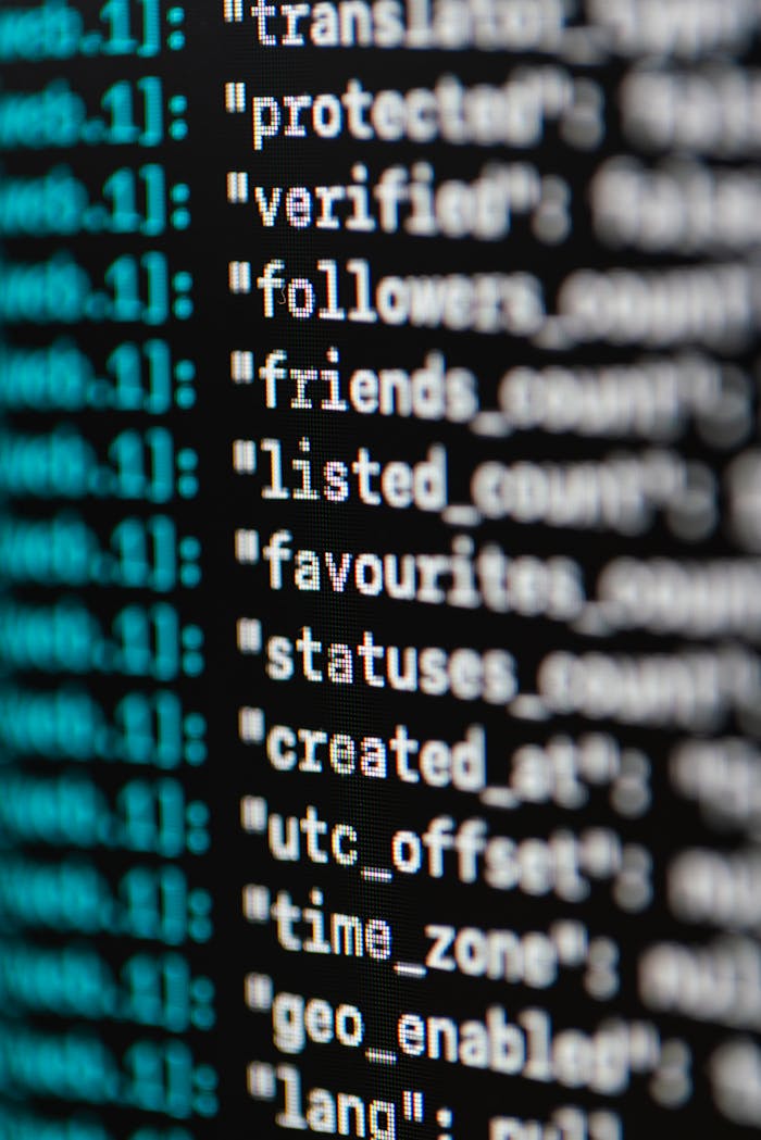 team-03 Extreme close-up of computer code displaying various programming terms and elements.